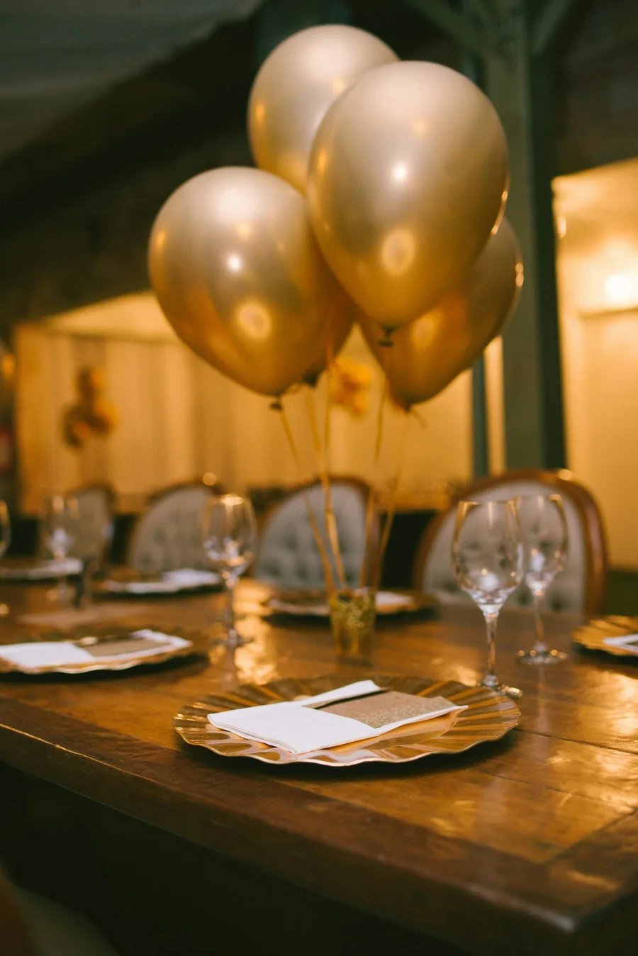 Gold balloons on a celebration table