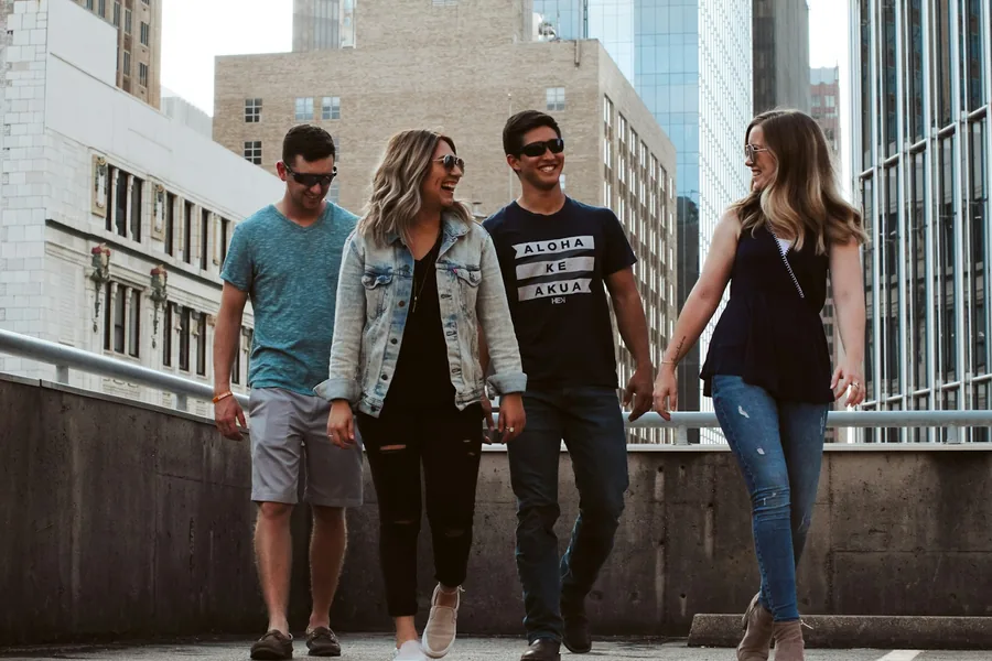 Friends walking together through a city